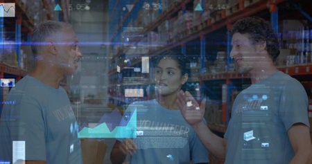 Screens with data processing against male and female volunteers high fiving each other at warehouse. logistics and transportation business conceptの写真素材