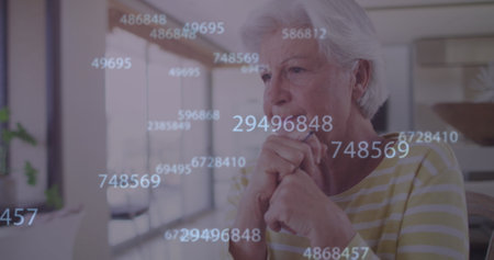 Image of numbers processing over thoughtful caucasian senior woman leaning on at home. retirement...