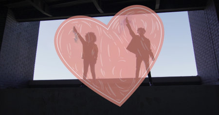 Image of read heart over two woman lifting fists. female power, feminism and gender equality concept digitally generated image.の写真素材