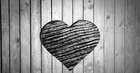 Image of heart shape cut in wood, with moving wood grain pattern, black and white. Nature and love, retro monochrome abstract background concept digitally generated image.の写真素材