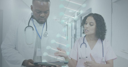 Image of dna and data processing over diverse doctors in hospital. Global healthcare, science, medicine, research, computing and data processing concept digitally generated image.の写真素材