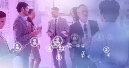 Multiple profile icons floating against group of business people partying at office. global business and technology conceptの写真素材