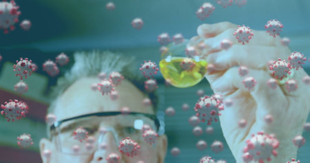 Image of coronavirus cells flowing over a male laboratory worker examining sample during the research. Covid 19 pandemic health care science medicine concept digital composite.の写真素材
