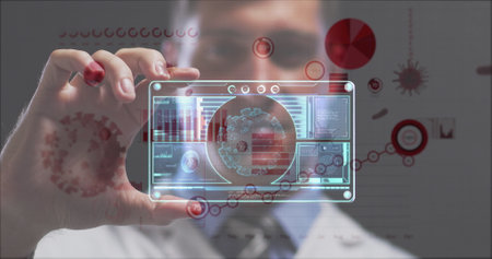 Image of covid 19 cells and statistics over man holding screen with covid 19 cell. global coronavirus pandemic, medicine and research concept digitally generated image.の写真素材