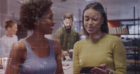 Image of financial data processing over diverse business people working at office. Global business, finances and digital interface concept digitally generated image.の写真素材