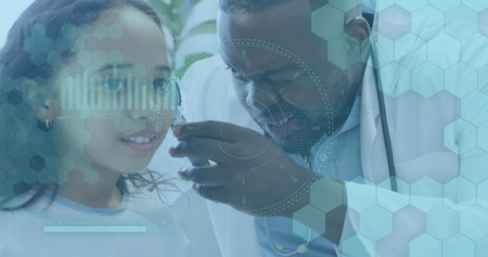 Image of medical data processing over african american male doctor with girl patient. Global healthcare, science, medicine, research and data processing concept digitally generated image.の写真素材