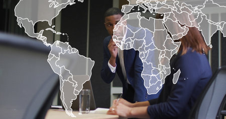 Image of world map over diverse business people in office. Global business and digital interface...