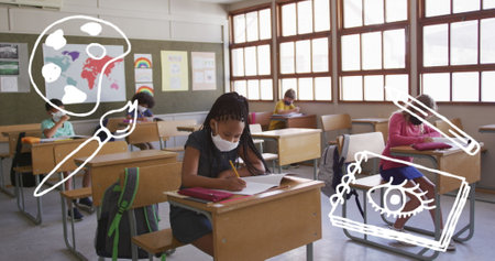 In school, diverse group of young students is focusing on their work. African American girl with...