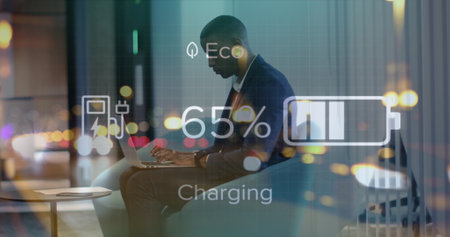 Image of data processing over african american businessman using laptop. Global business and digital interface concept digitally generated image.の写真素材