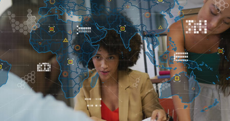 Image of world map over diverse business people in office. Global business and digital interface concept digitally generated image.の写真素材