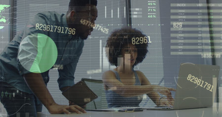 Image of financial data processing over diverse business people working at office. Global business, finances and digital interface concept digitally generated image.の写真素材