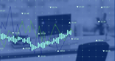 Image of financial data processing against computer on office desk. Global economy and business technology conceptの写真素材