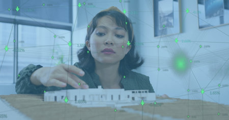 Image of network of connections over asian businesswoman working at office. Global business,...