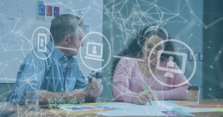 Image of network of connections over diverse business people discussing work at office. Global...