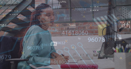 Image of data processing over african american businesswoman using computer. Global business and...