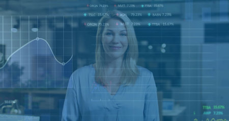 Image of financial data processing over caucasian businesswoman in office. Global finance, business, connections, computing and data processing concept digitally generated image.の写真素材