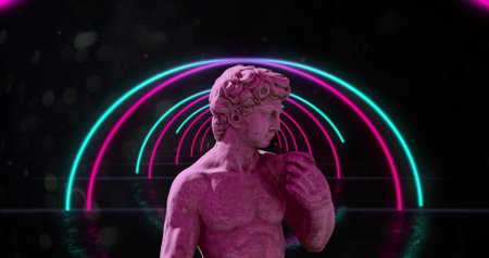 A statue poses against a neon light backdrop, with copy space. The scene blends classical art with modern neon aesthetics for a striking contrast.の写真素材
