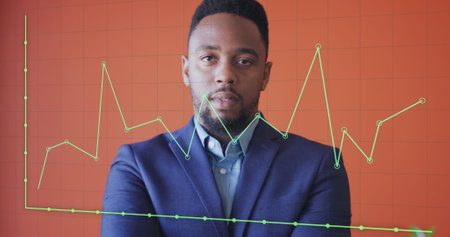 Image of financial data processing over african american businessman smiling. Global business, finances and digital interface concept digitally generated image.の写真素材