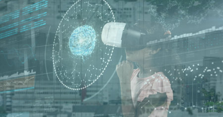 A biracial girl is immersed in virtual reality, exploring a digital interface. She stands against a...