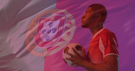 Image of african american male soccer player over flag of portugal. Global patriotism, celebration, sport and digital interface concept digitally generated image.の写真素材