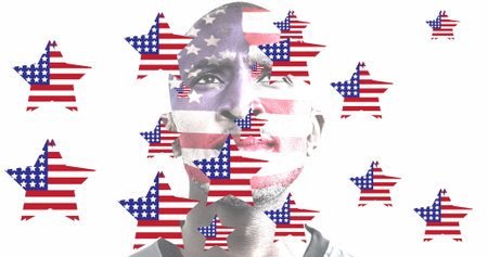 Image of american flag stars moving over thoughtful african american man, on white. patriotism, independence and celebration concept digitally generated image.の写真素材