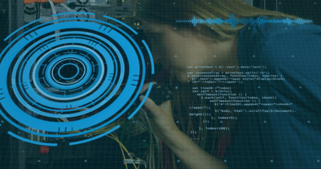 Image of scope scanning and data processing over woman checking cables in a computer server room. Global business digital interface technology and networking concept digitally generated image.の写真素材