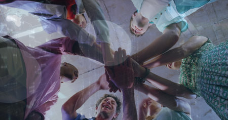 Image of data processing over diverse business people teaming up. Global business and digital...