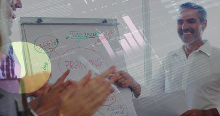 Image of statistical data processing over caucasian senior man giving a presentation at office. Business data and analytics technology conceptの写真素材