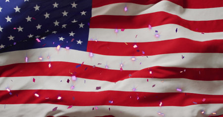 Image of confetti over flag of usa. Global patriotism, celebration, sport and digital interface concept digitally generated image.の写真素材