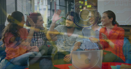 Image of data processing on digital screen over diverse female and male coworkers. Business, data...
