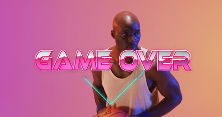 Image of game over text over neon pattern and african american basketball player. Sports, competition, image game and communication concept digitally generated image.の写真素材