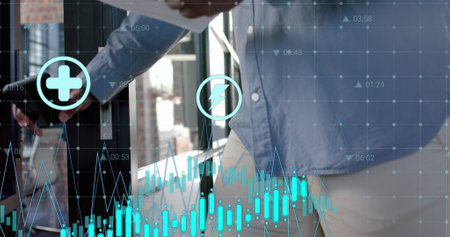 Data processing and media icons over african american casual businessman with smartphone in office. Internet, business, data, digital interface, connection and communication digitally generated image.の写真素材