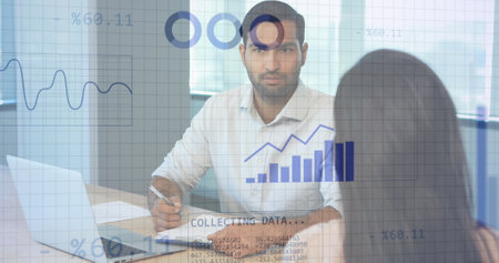 Image of financial data processing over diverse business people working in office. Global business, finances, computing and data processing concept digitally generated image.の写真素材