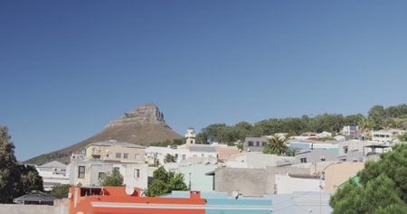 General view of cityscape with houses, mountain, trees and blue sky. Travel and landscape concept.の写真素材