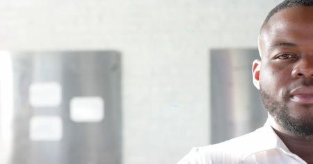 Digital contact portraits over happy african american casual businessman in office. Casual business, data, digital interface, social network and online communication digitally generated image.の写真素材