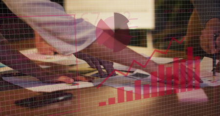 Image of financial data processing over diverse business people in office. Global business, finances, computing and data processing concept digitally generated image.の写真素材