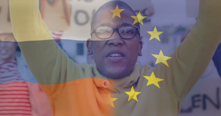 Image of flag of russia and european union over african american male protester. ukraine crisis and international politics concept digitally generated image.の写真素材