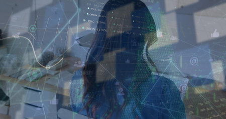 Image of data processing over biracial businesswoman using tablet. Global business and digital interface concept digitally generated image.の写真素材