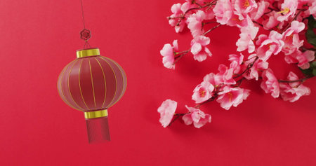 Image of lantern and chinese pattern with copy space on red background. Chinese new year, festivity, celebration and tradition concept digitally generated image.の写真素材