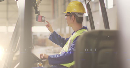 Image of glowing light over asian man working in warehouse. labor day, work, workers, tradition and...
