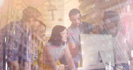 Image of network of connections over group of business people using computer in office. global business, finances and networking concept digitally generated image.の写真素材