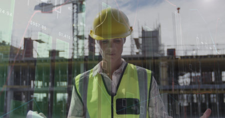 Image of statistics processing over female architect holding plans at construction site. business, development and productivity concept digitally generated image.の写真素材