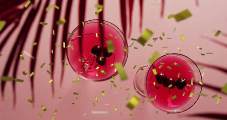 Image of confetti falling and cocktails on pink background. Party, drink, entertainment and celebration concept digitally generated image.の写真素材