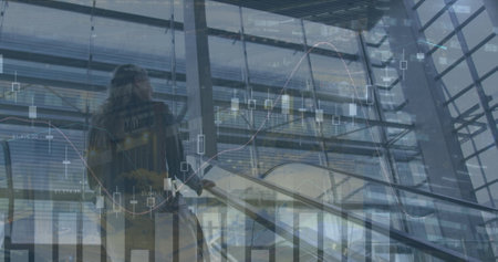 Image of data processing over caucasian businesswoman on stairs. global business, finances,...