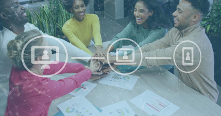Image of icons and data processing over diverse business people stacking hands in office. Global...