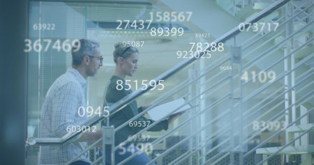 Image of data processing over caucasian businesswoman working in office. Global business, finances, computing and data processing concept digitally generated image.の写真素材