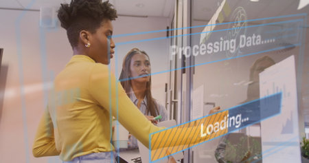 Image of data processing text over diverse business people working in office. Global business, finances, computing and data processing concept digitally generated image.の写真素材