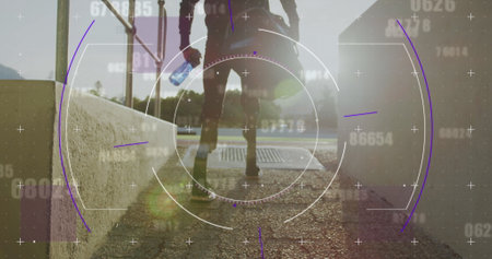 Image of digital data processing over disabled male athlete with running blades on running track. global sports, competition, disability and digital interface concept digitally generated image.の写真素材
