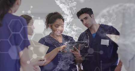 Image of cells and medical data over diverse female and male doctors in discussion using tablet. Medical and healthcare services concept digitally generated image.の写真素材