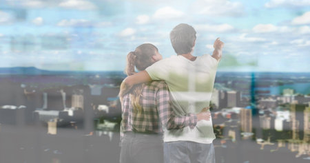 Image of windows over couple embracing looking at cityscape. planning future concept digitally...
